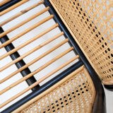 Pair of designer armchairs in curved wood and wicker