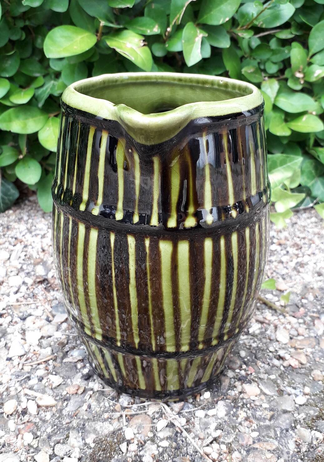 Green and brown ceramic jug
