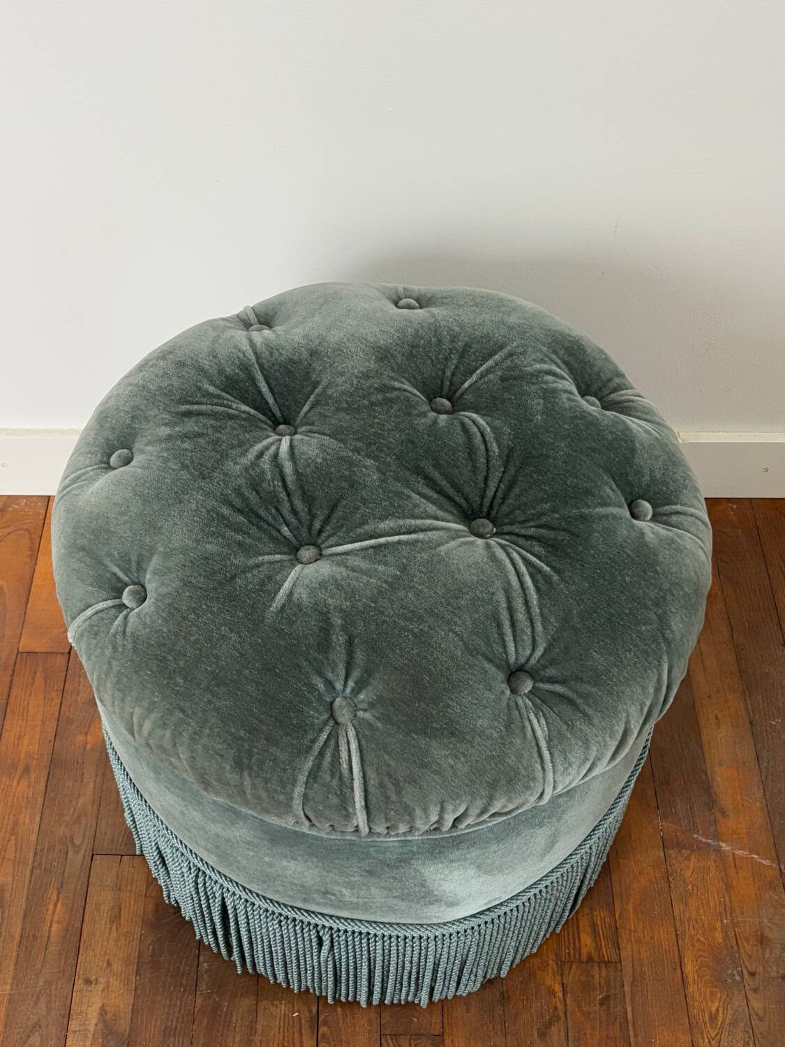 Velvet upholstered pouf