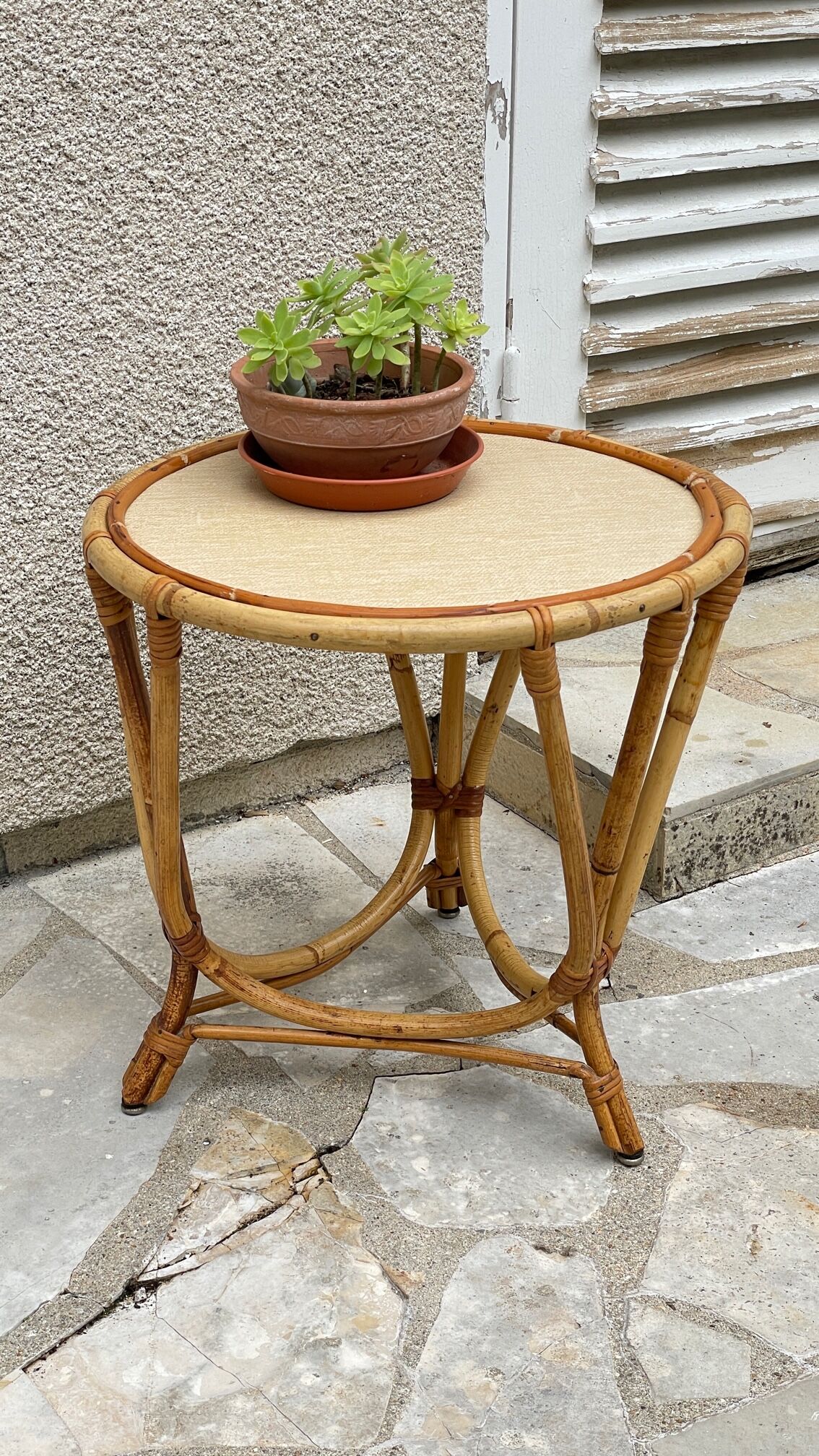 Round coffee table in vintage rattan