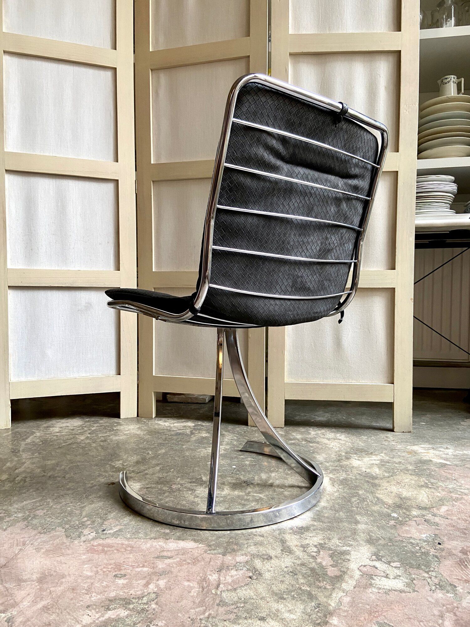 2 chairs in chromed metal and black woven skaï 1970s