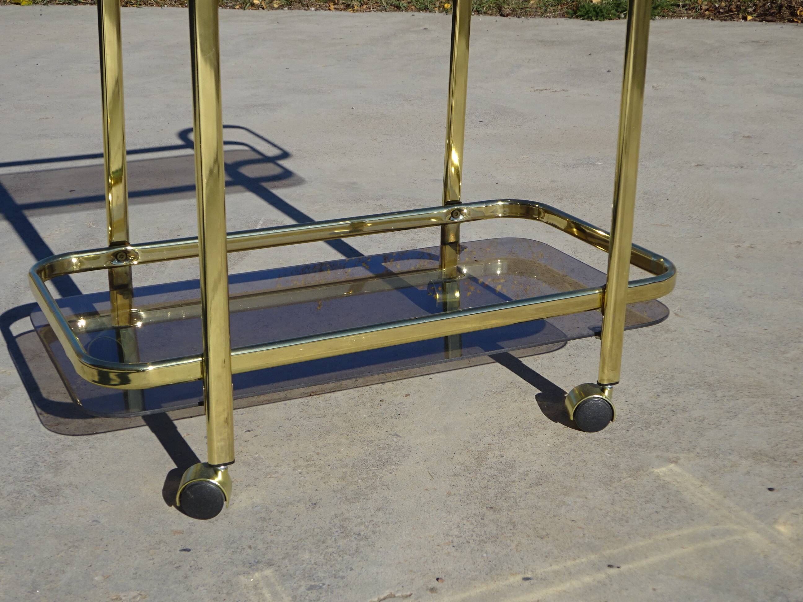 Golden metal and smoked glass dessert table