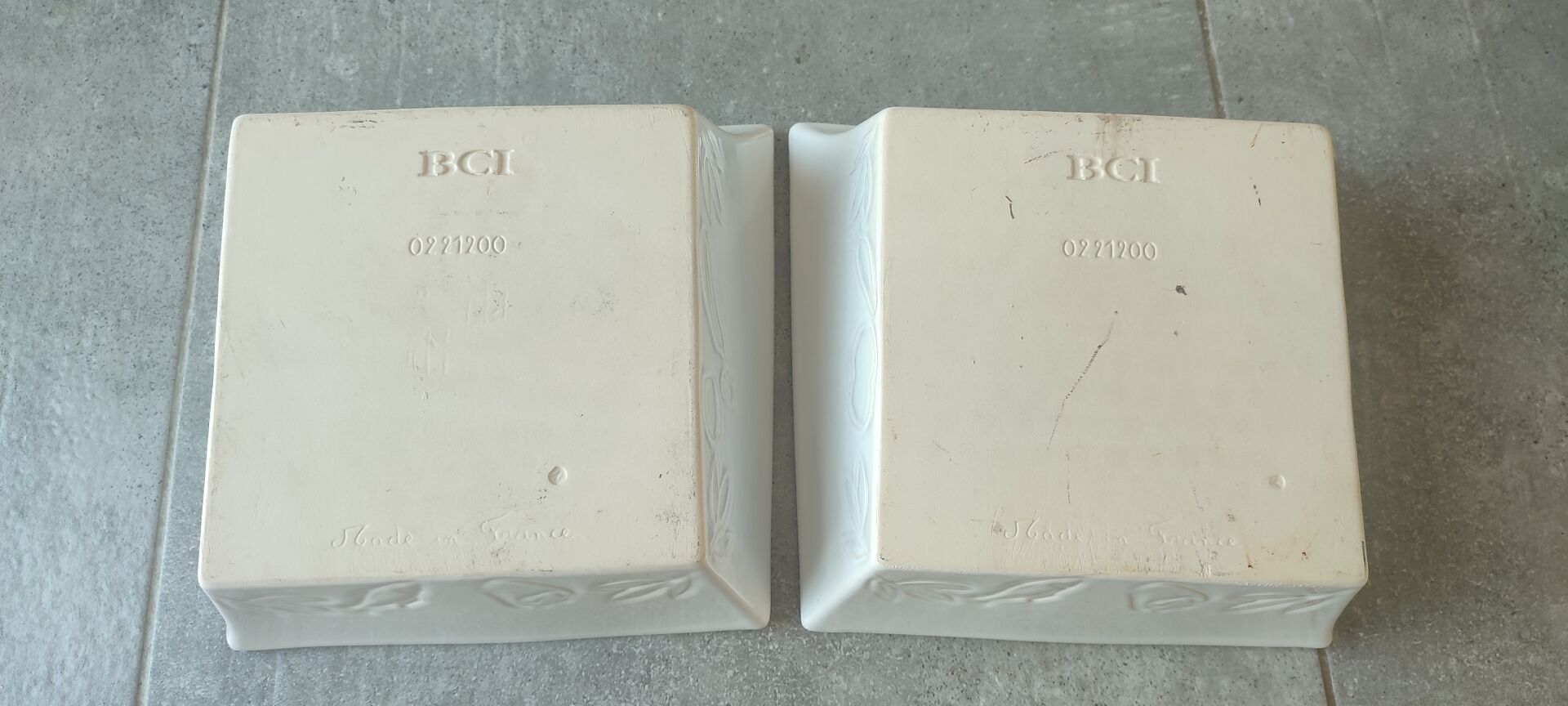 Two asymmetrical square gratin dishes BCI numbered, Made in France