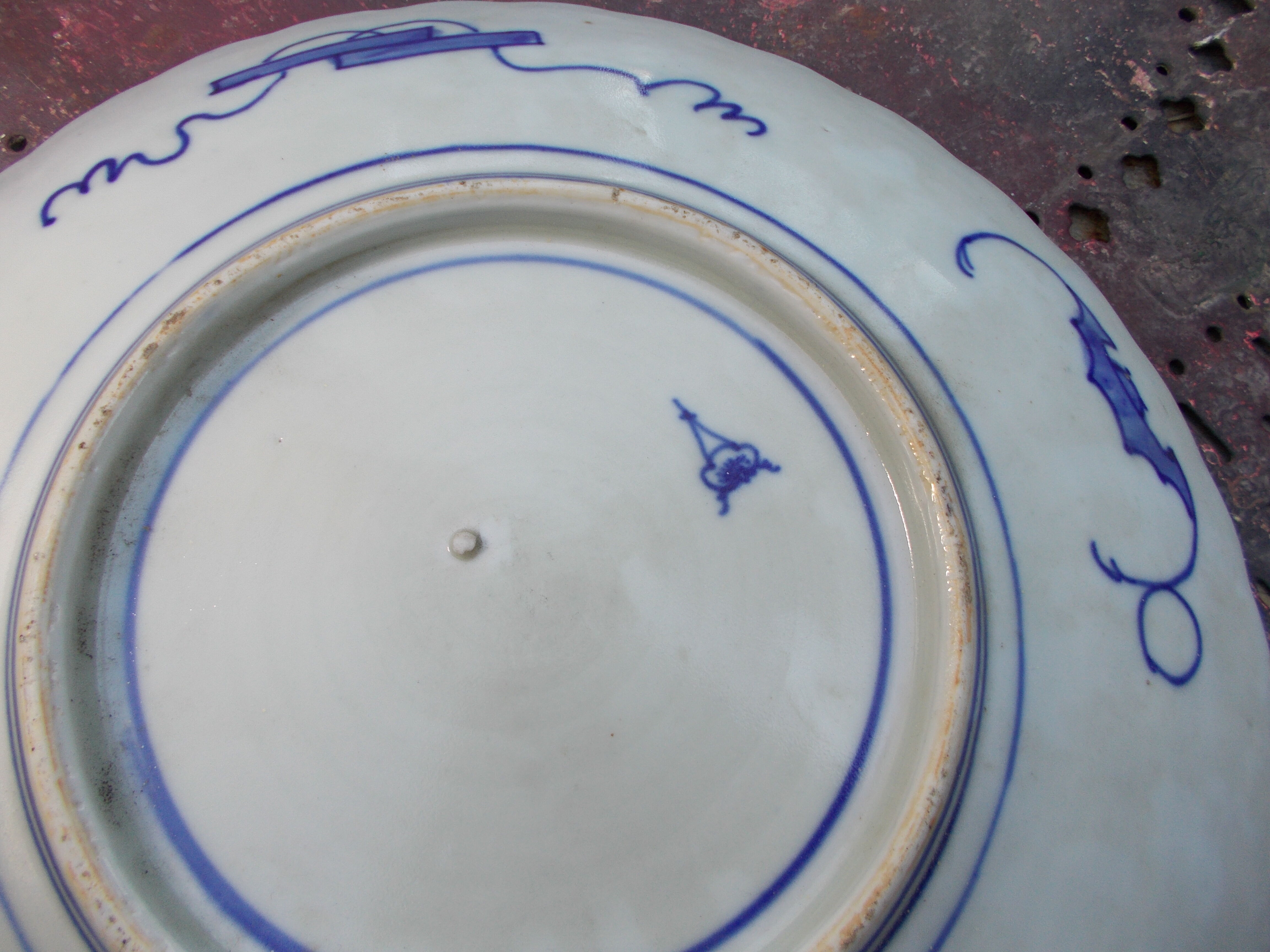 Ancient round porcelain dish from Japan Imari