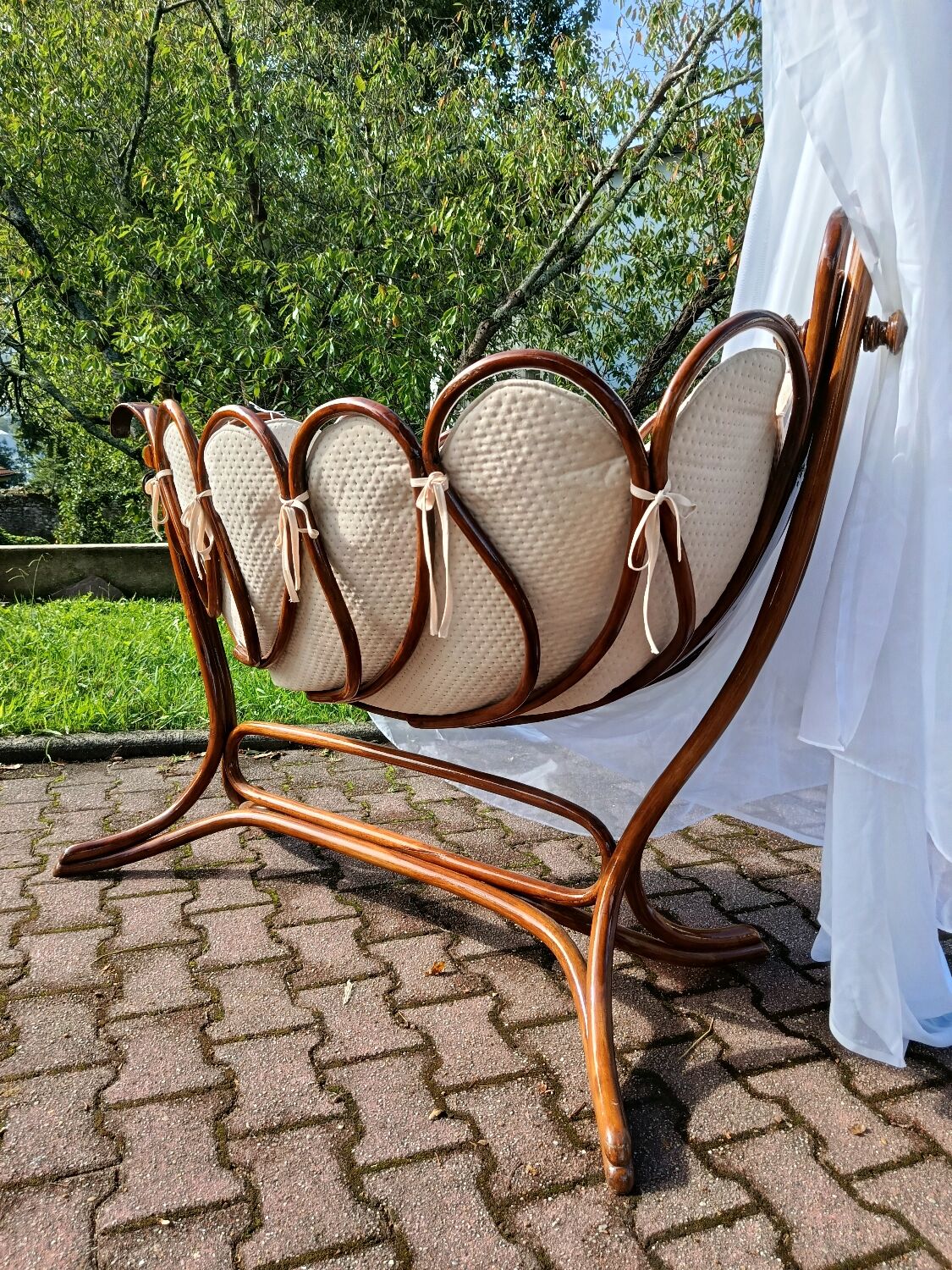 Antique cradle by J&J Khon