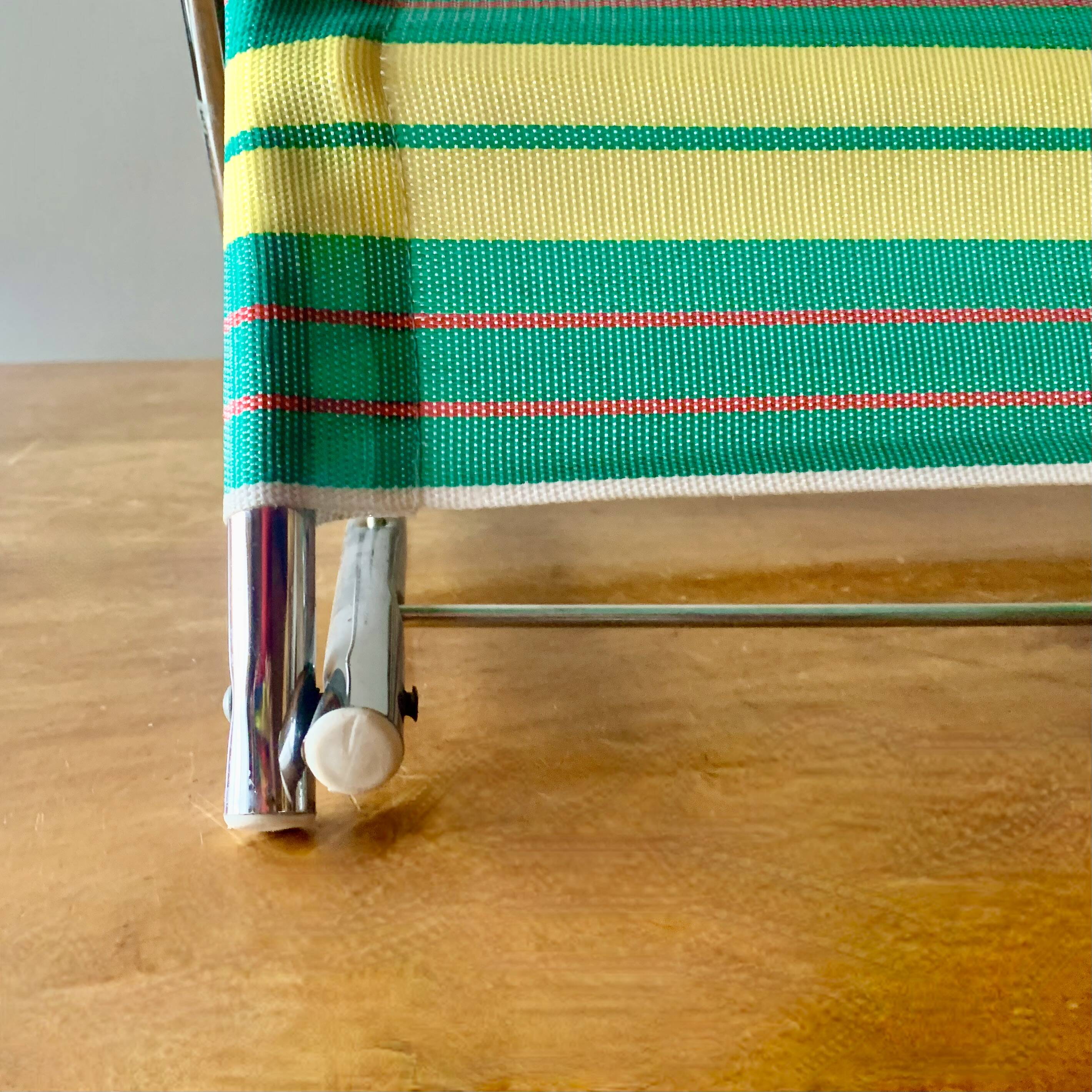 Vintage folding beach chair in chrome metal and woven plastic