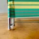 Vintage folding beach chair in chrome metal and woven plastic