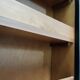 Wardrobe trunk on casters in mahogany and woven rattan.