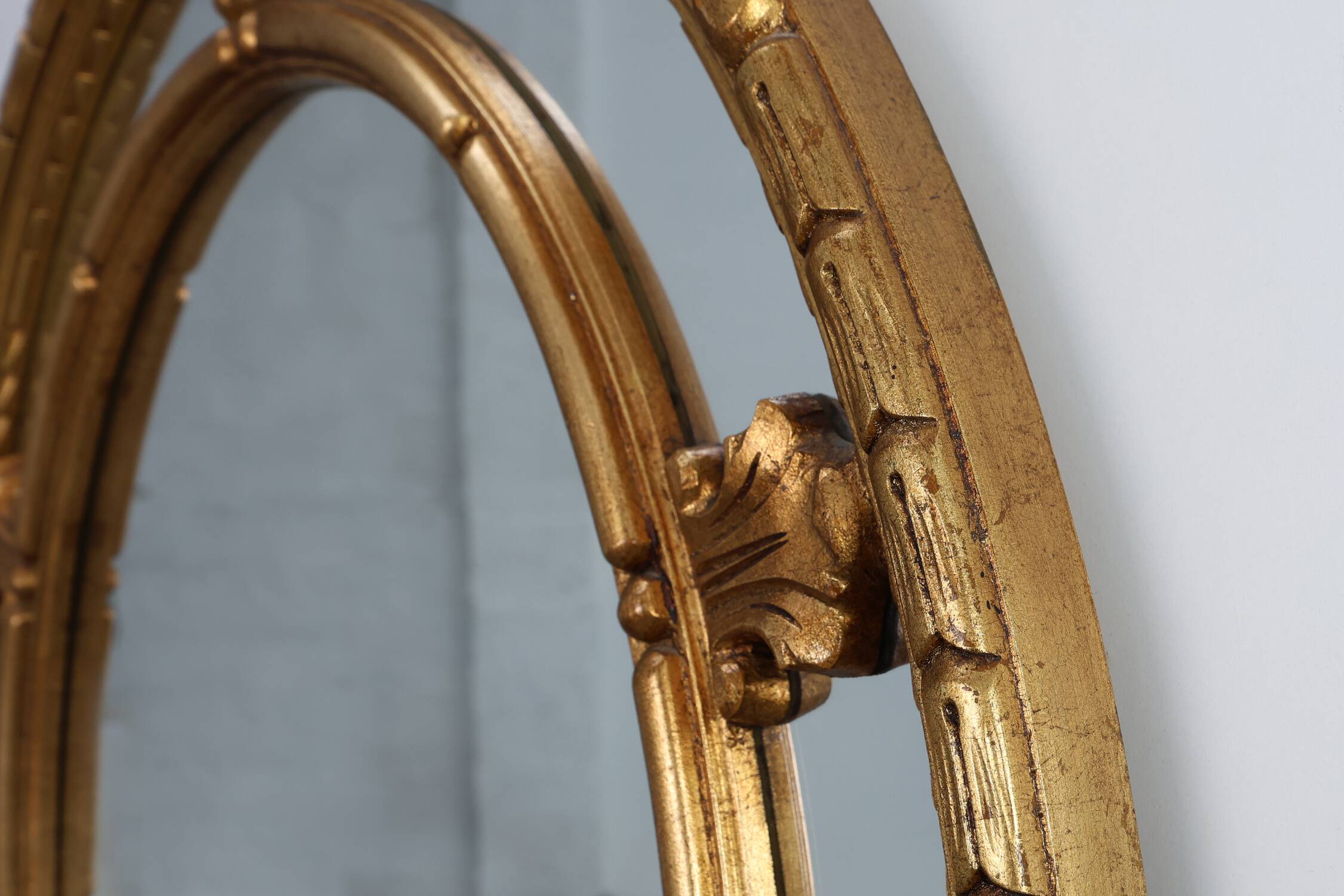 20th century neo-classical style tilted oval mirror by Deknudt, Belgium