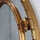 20th century neo-classical style tilted oval mirror by Deknudt, Belgium