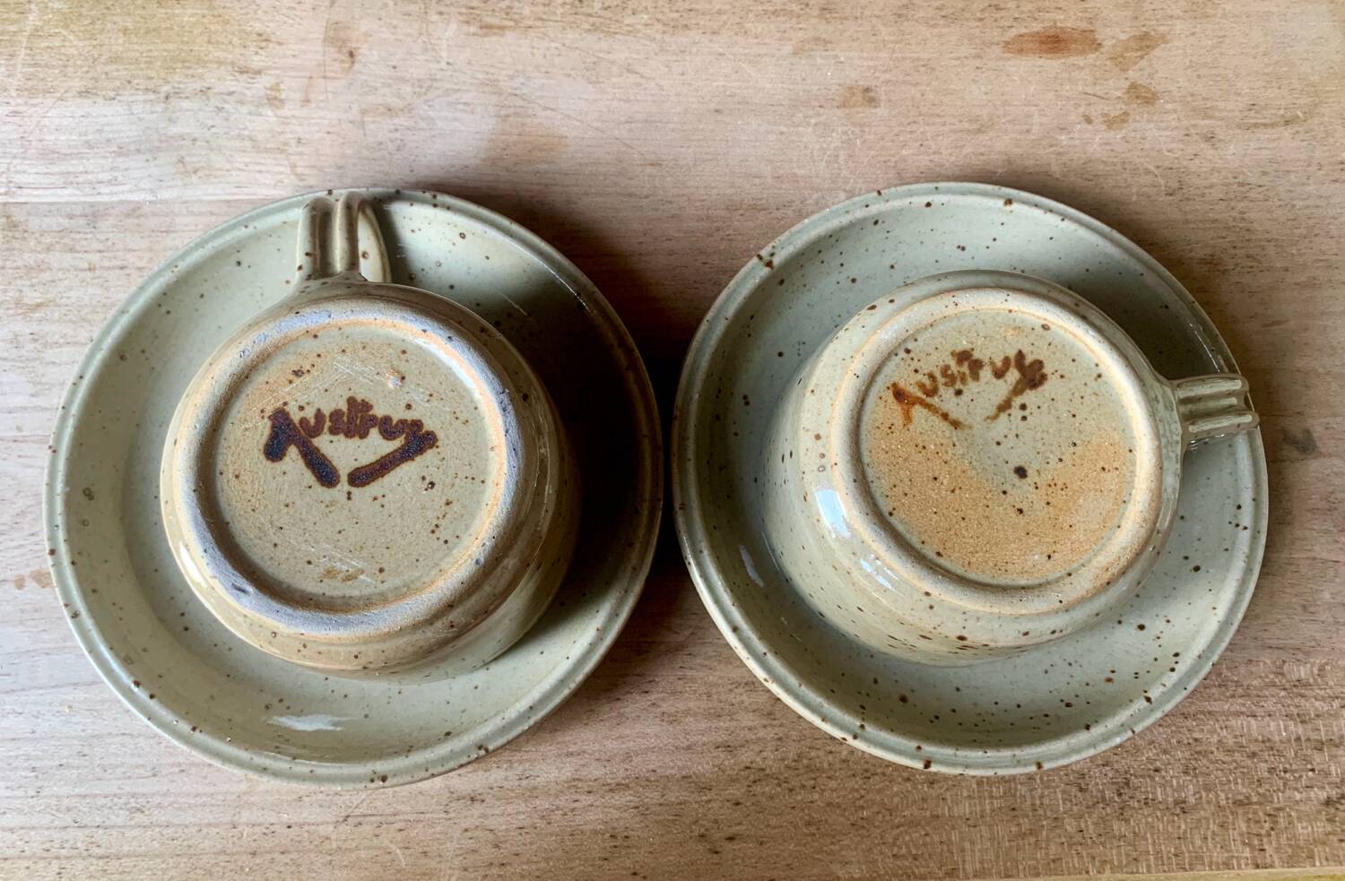 Two large Jean Austruy stoneware cups and saucers