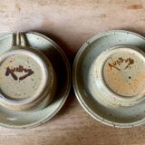 Two large Jean Austruy stoneware cups and saucers