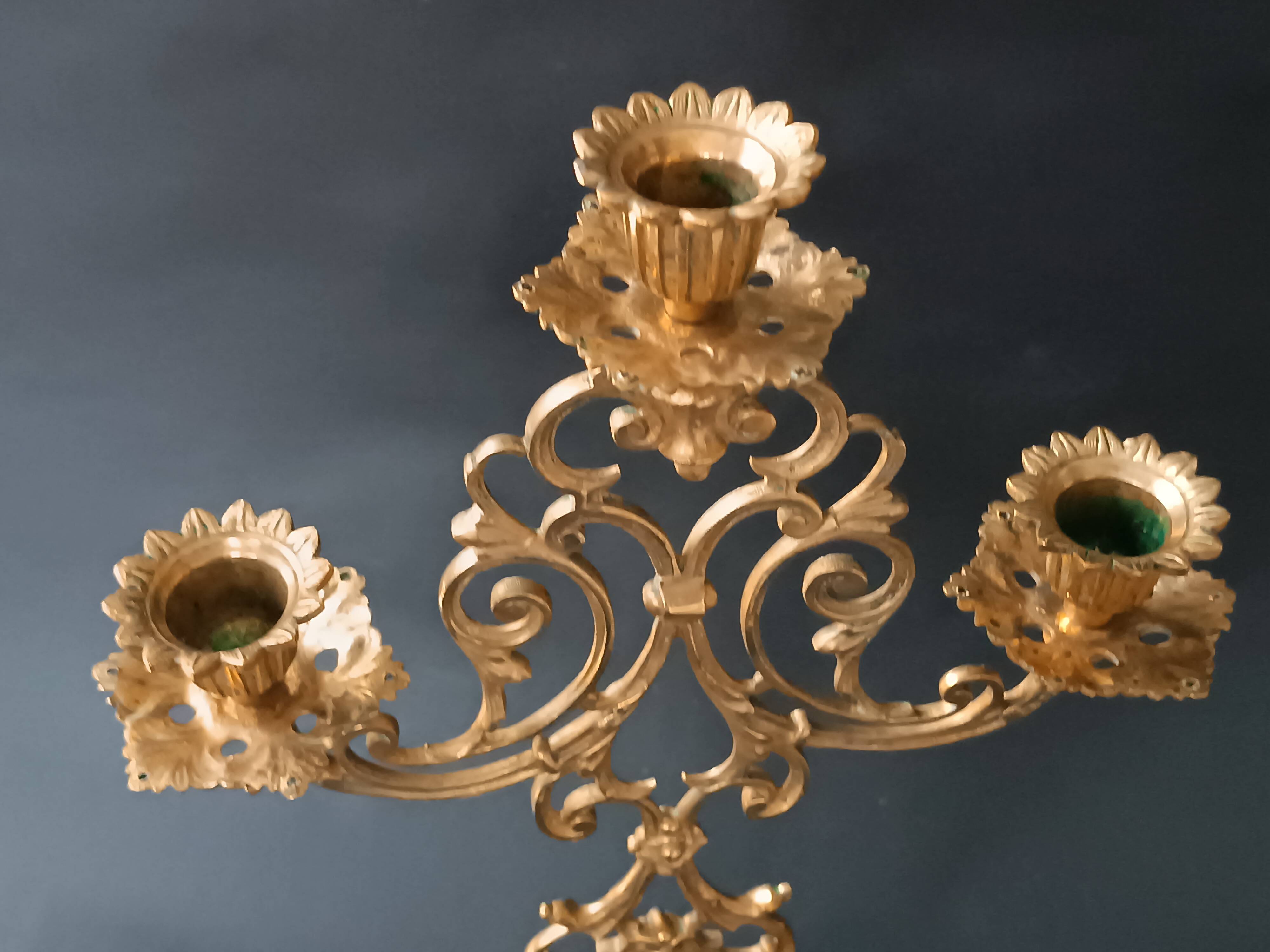 Antique three-light openwork brass church candelabrum.