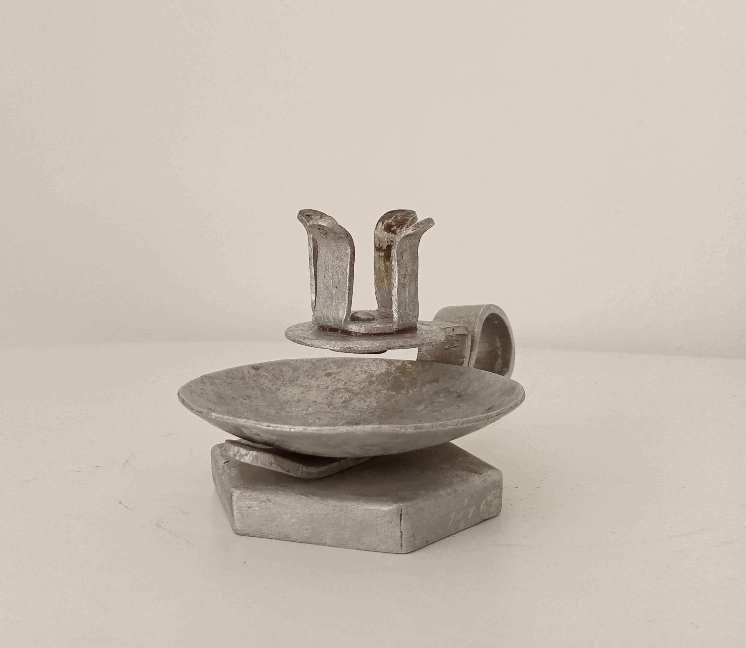 Vintage zinc hand candle holder