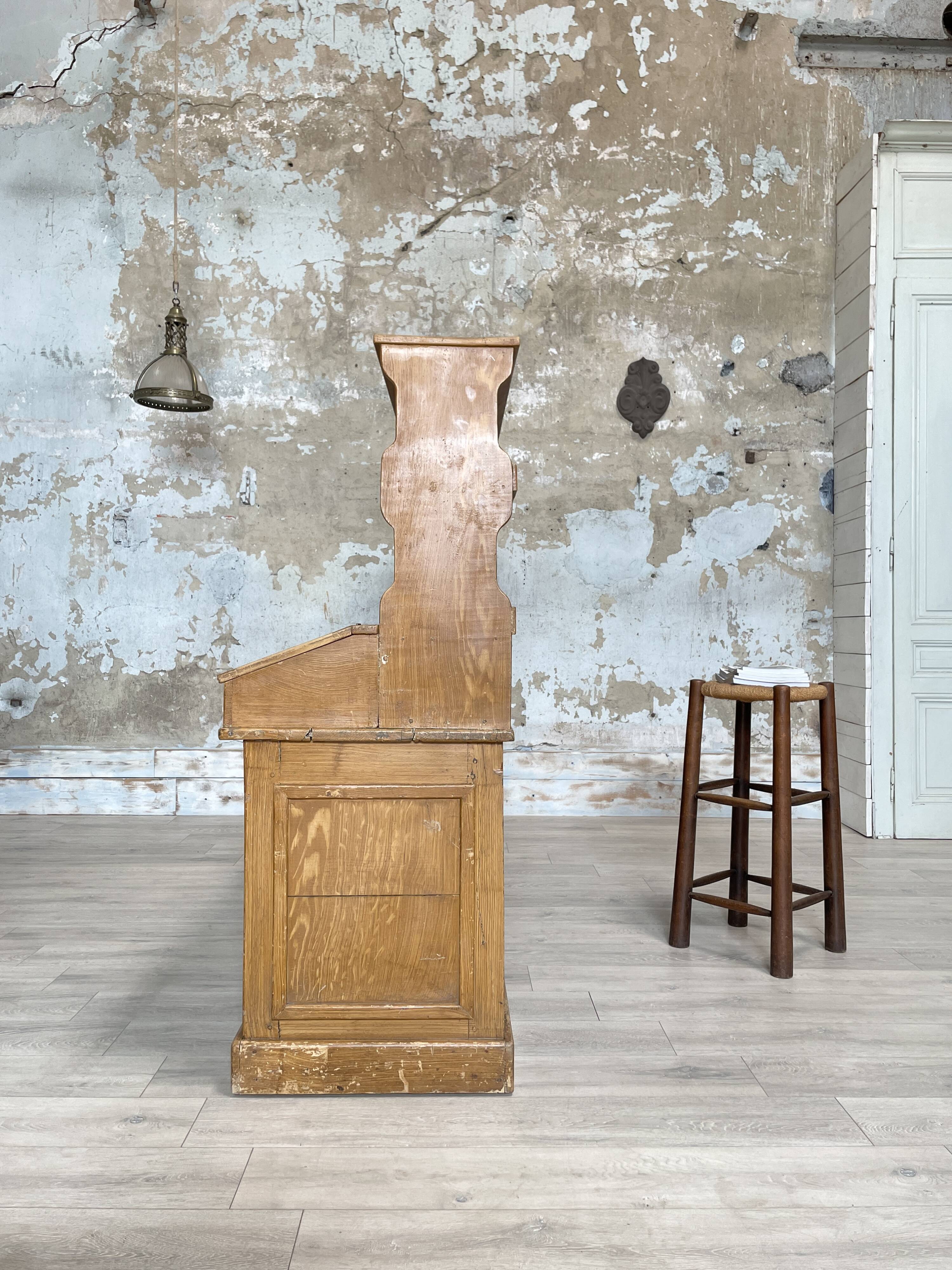 Wooden hardware cabinet painted with wood effect, circa 1940.