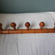 Bamboo-like wall coat rack with 5 mushroom hooks
