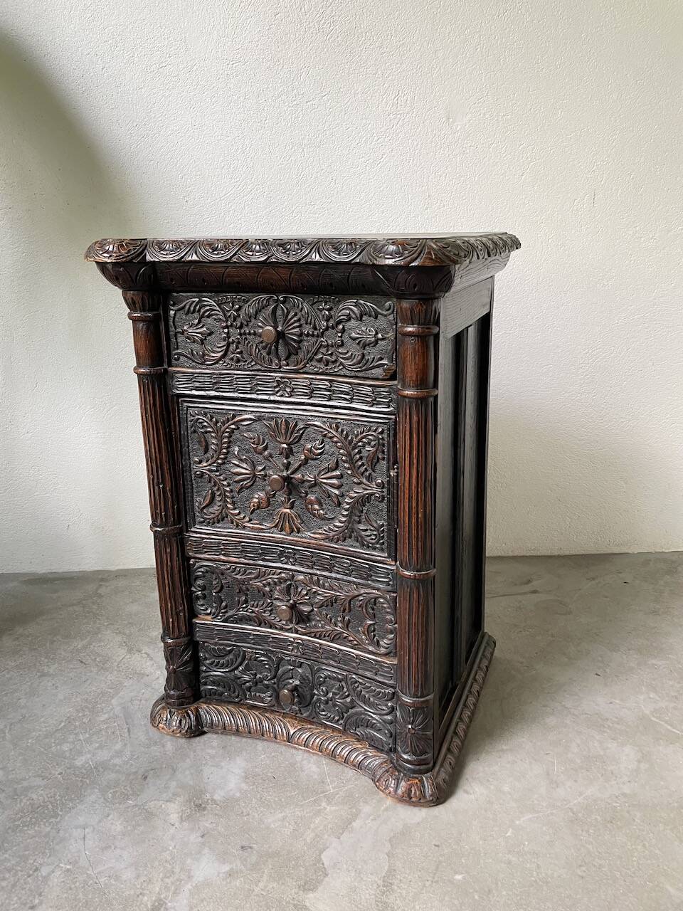 19th century chest of drawers in carved blackened pine