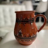 Terracotta ceramic carafe with geometric and white patterns