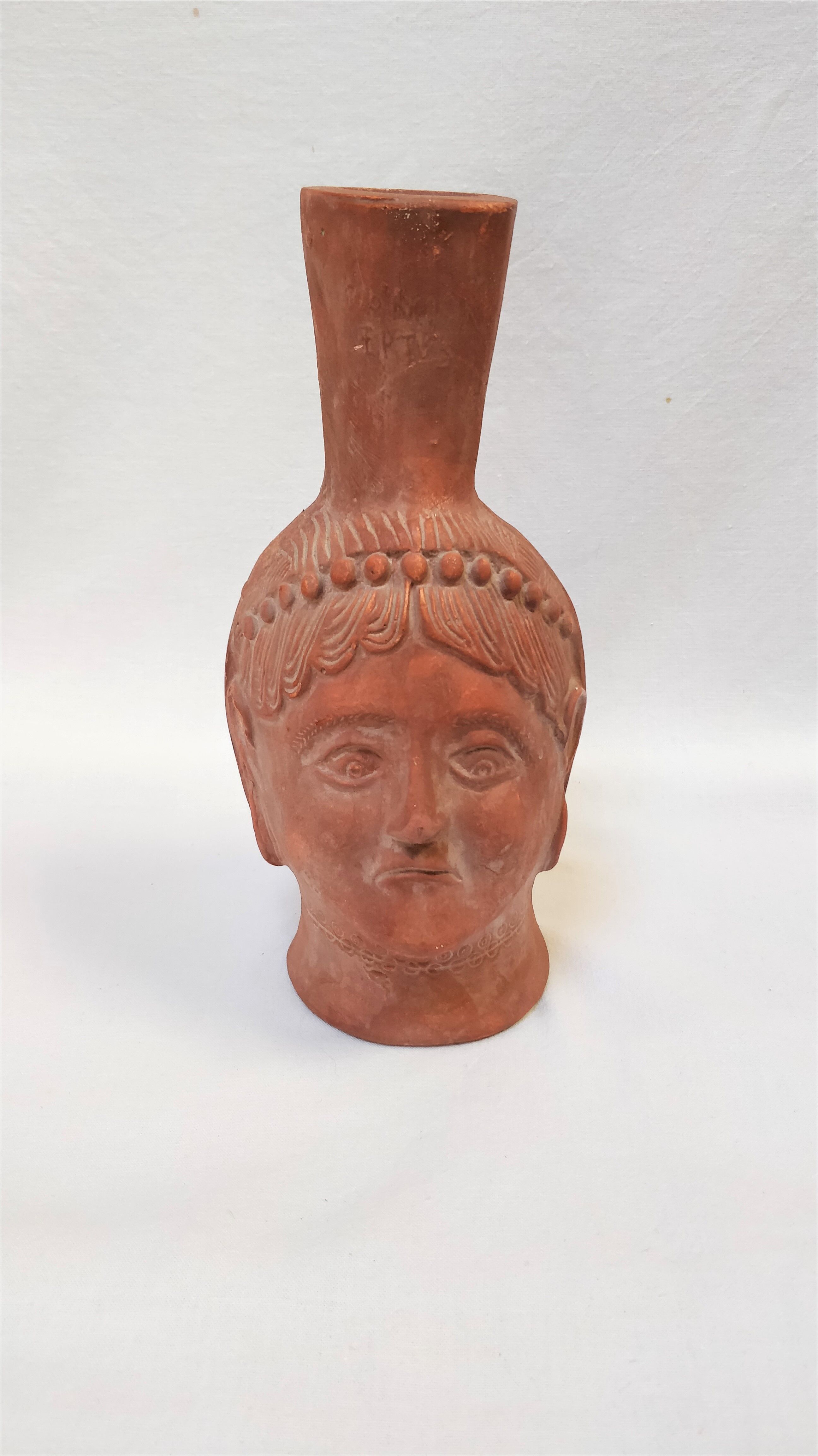 Jug vase with human head