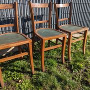 Set of four wooden bistro chairs, green seat, mid-20th century.