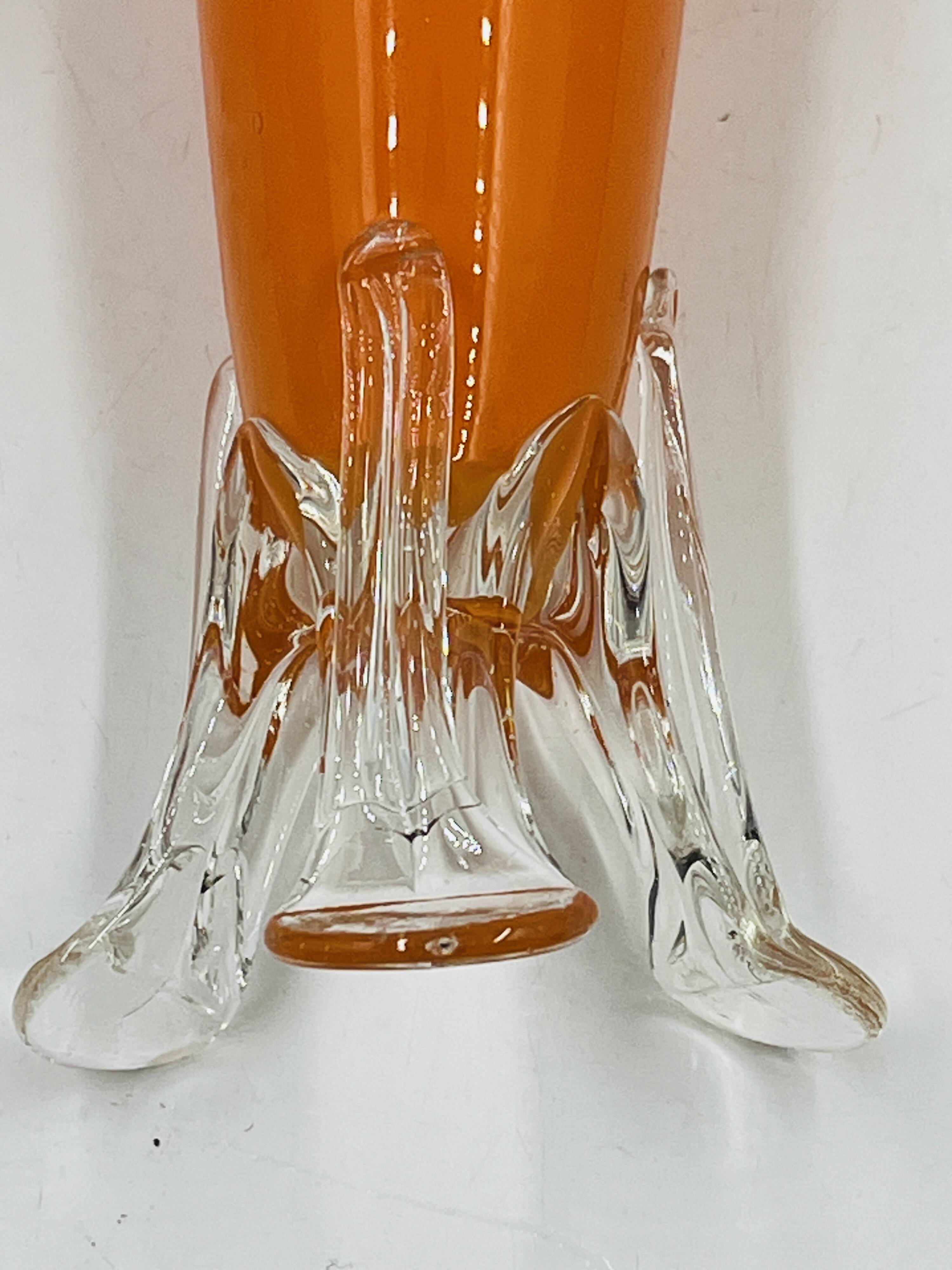 Vintage orange glass soliflore with a sculpted base.