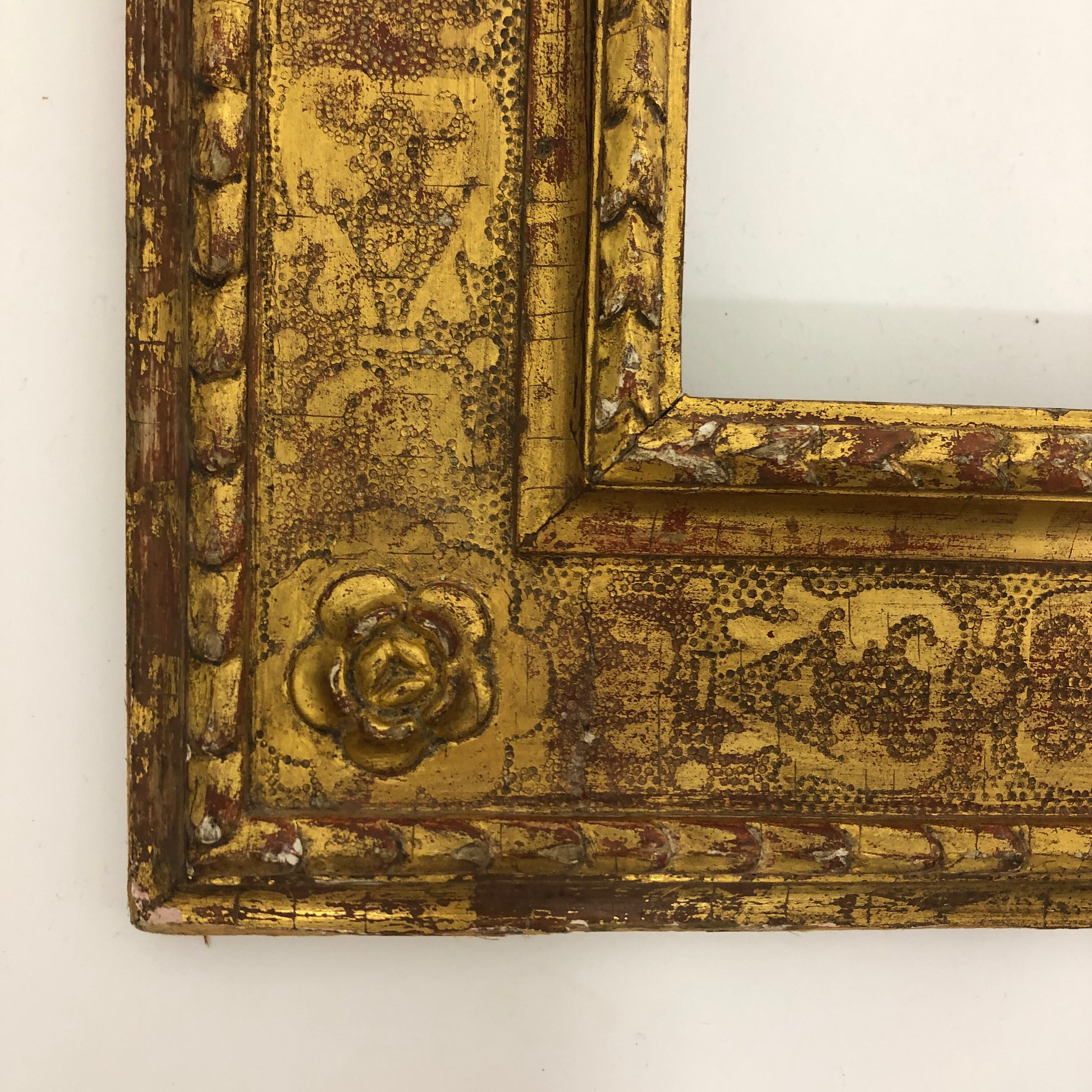 Vintage gilded frame decorated with stylized flowers