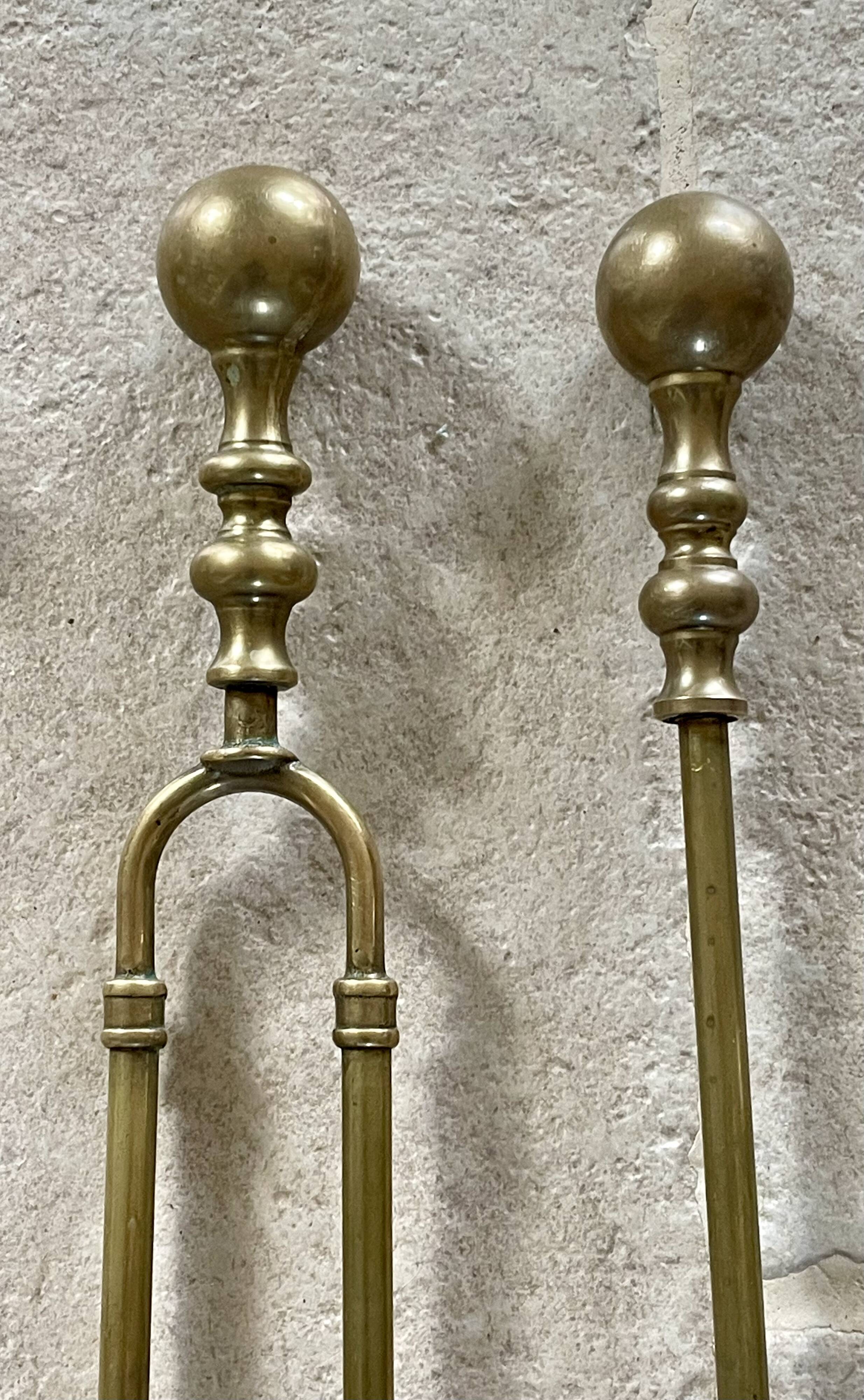 Brass fireplace accessory set with vintage stand