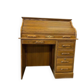Vintage American wooden desk with a roll-top.