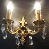 Pair of gilded bronze sconces and crystal pendants