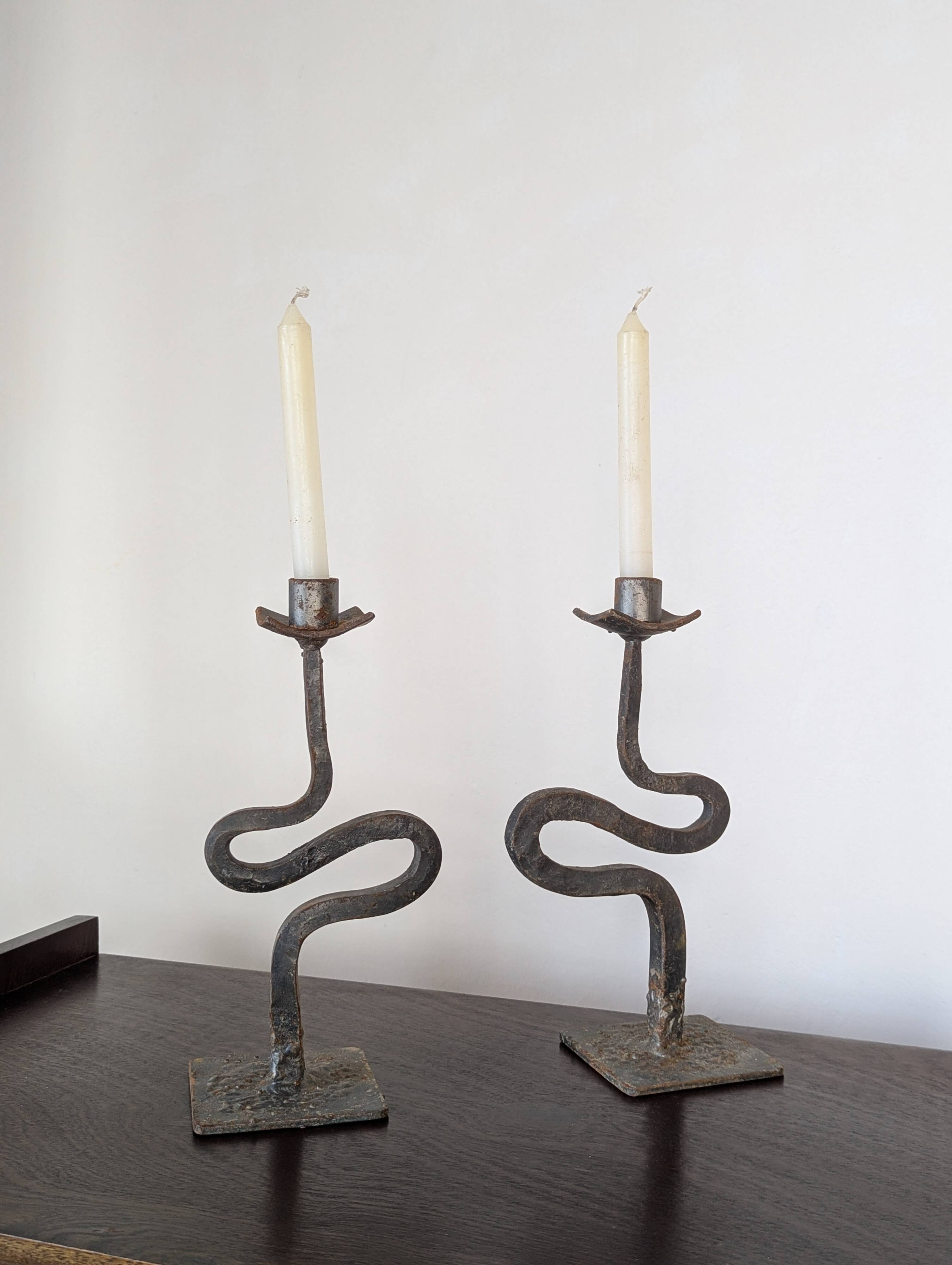 Pair of wrought iron candlesticks