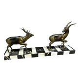 Bronze sculpture of a deer and doe in an Art Deco animal scene on a base.