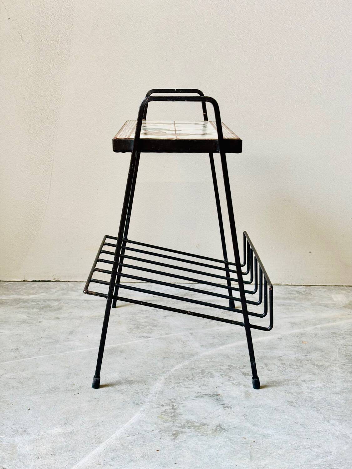 Vintage magazine table with Greek mythology motif.