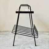 Vintage magazine table with Greek mythology motif.