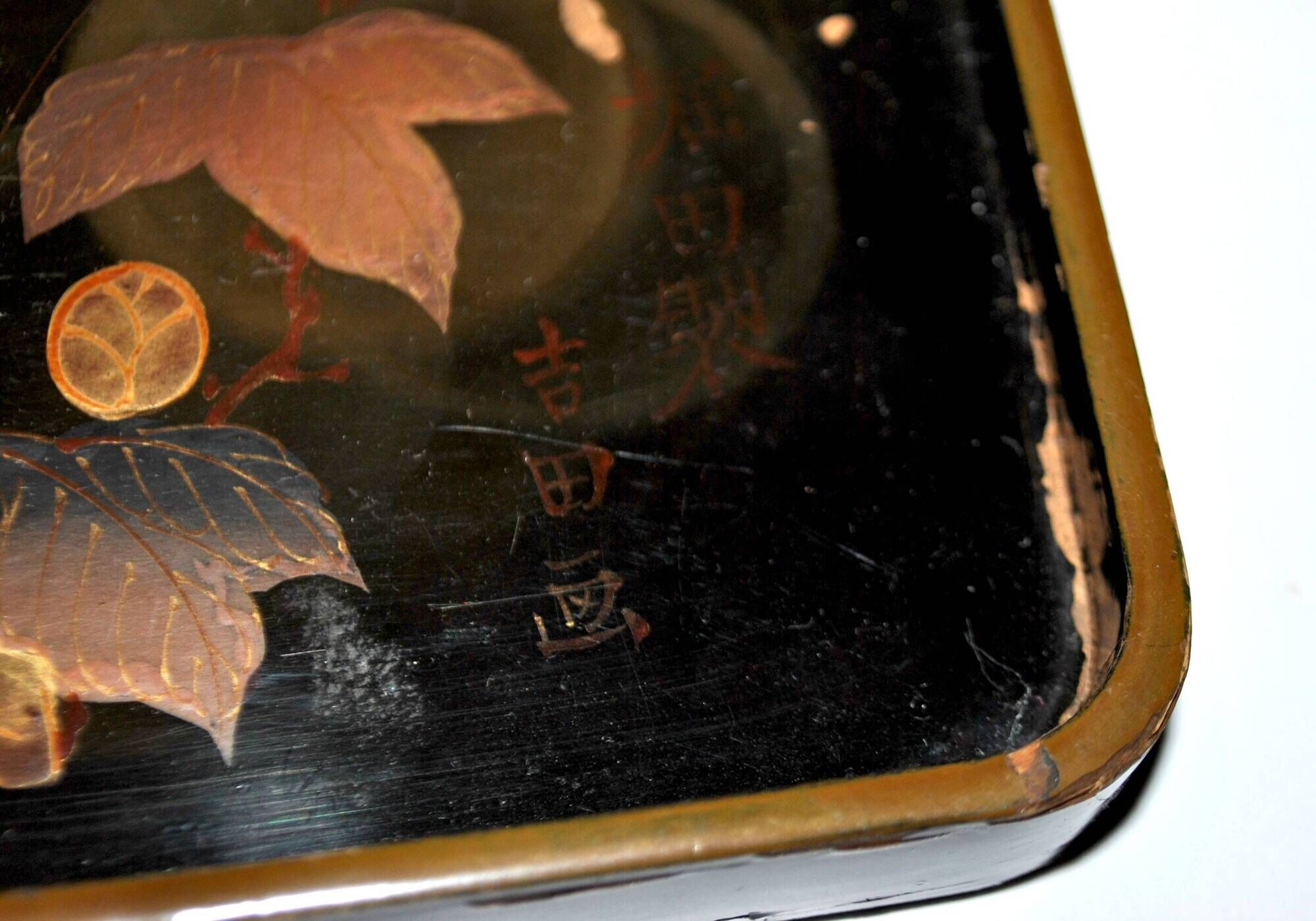 Set of two brown and black Chinese lacquer trays with bird decor