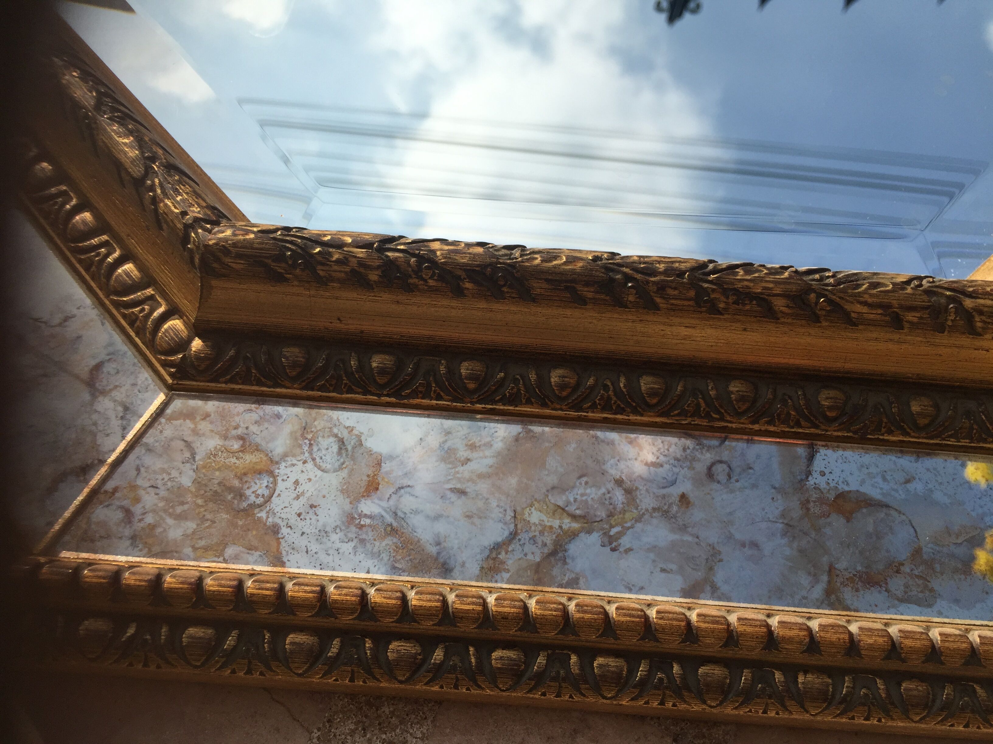 Antique mirror in gilded wood with beveled octagonal shape 72 x 63 cm