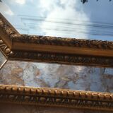 Antique mirror in gilded wood with beveled octagonal shape 72 x 63 cm