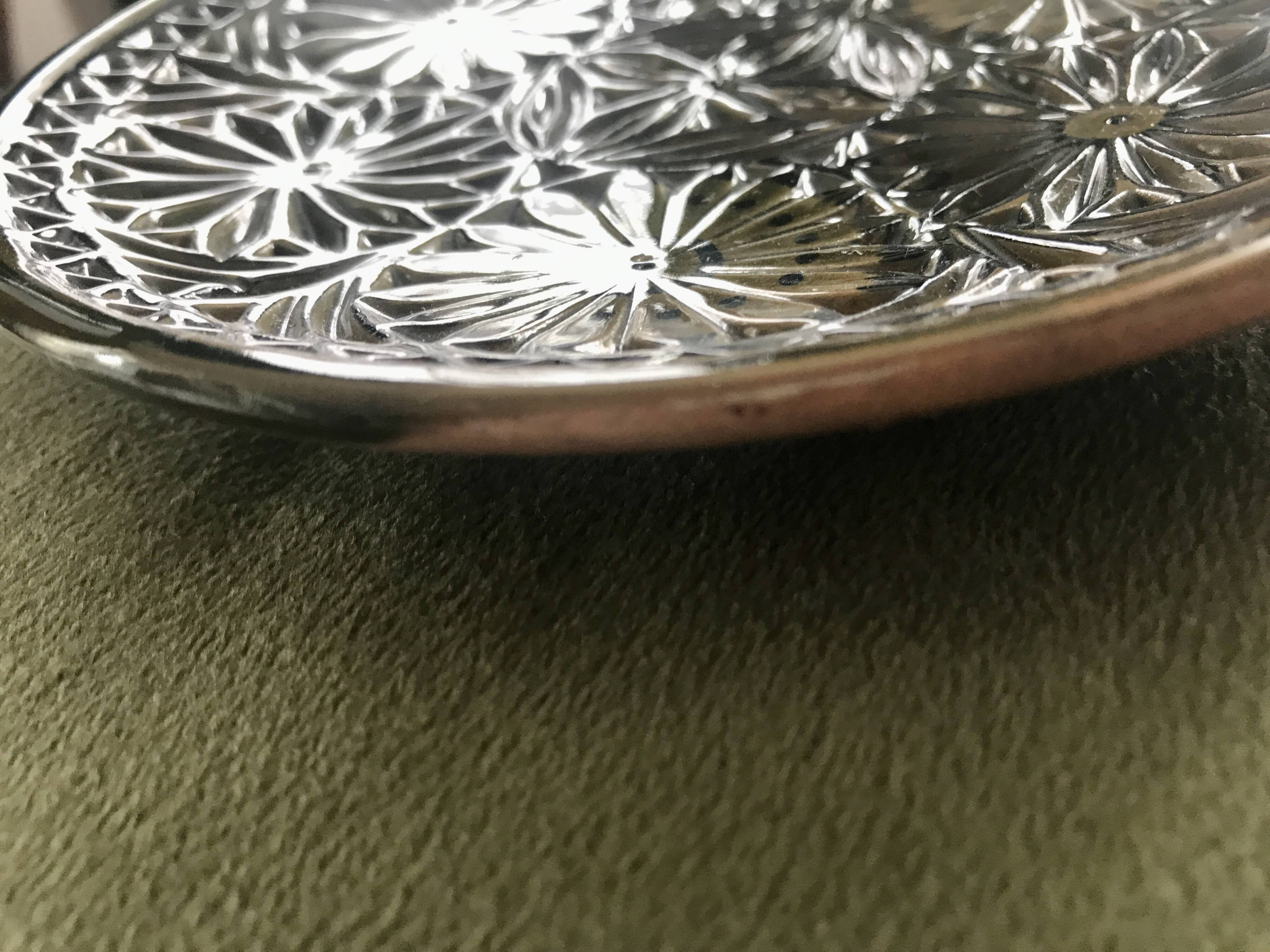 Small decorative chiseled ceramic plate