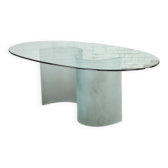 Italian oval glass dining table with a wavy matt base
