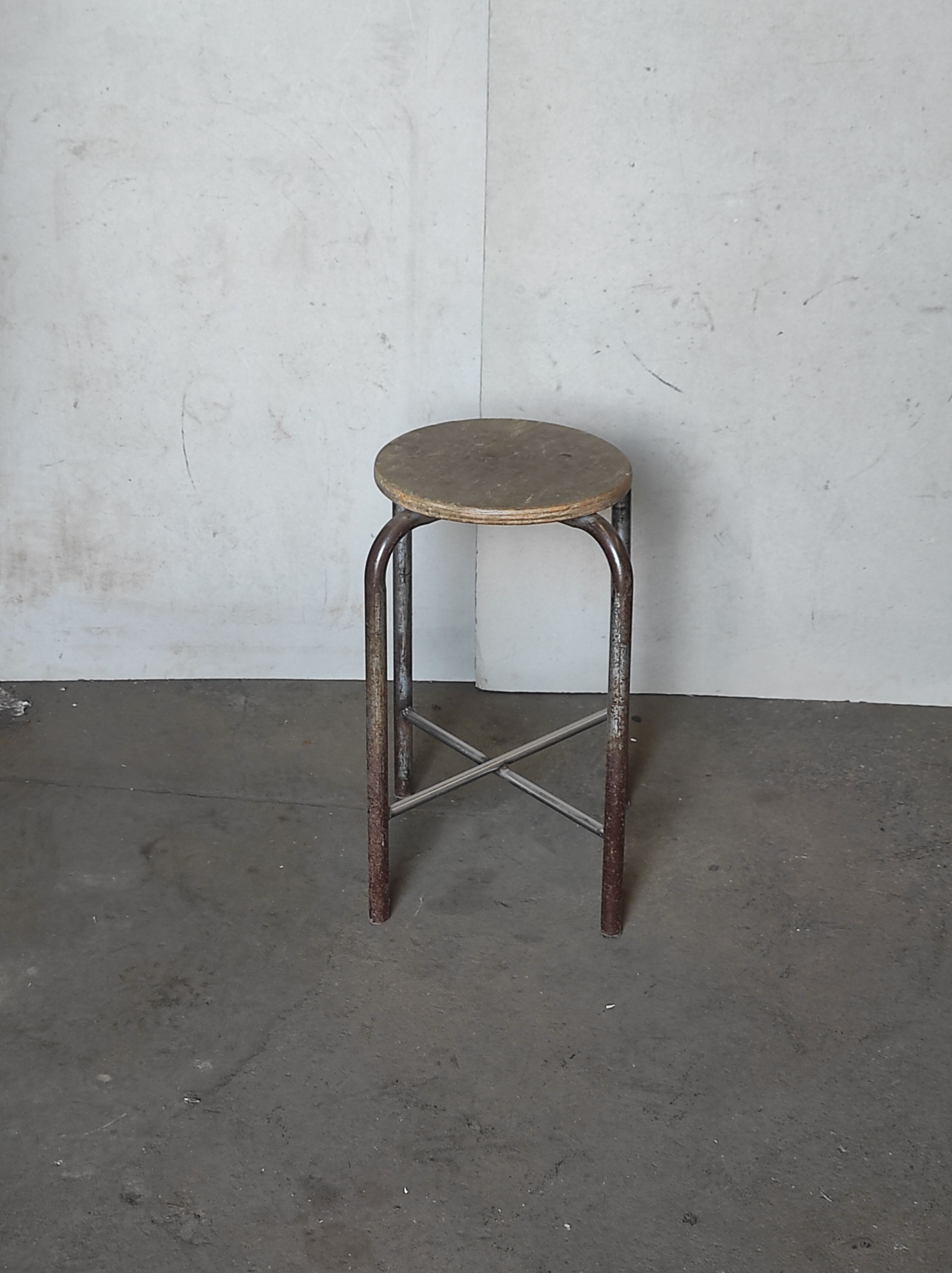 Old vintage metal and wood industrial workshop stool