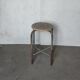 Old vintage metal and wood industrial workshop stool