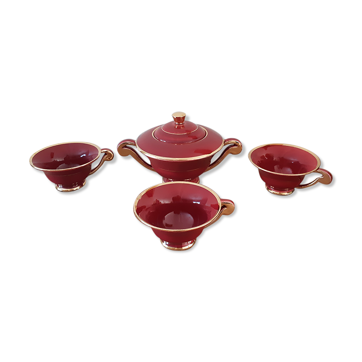 Tea, coffee and sugar cups made of red and gold porcelain