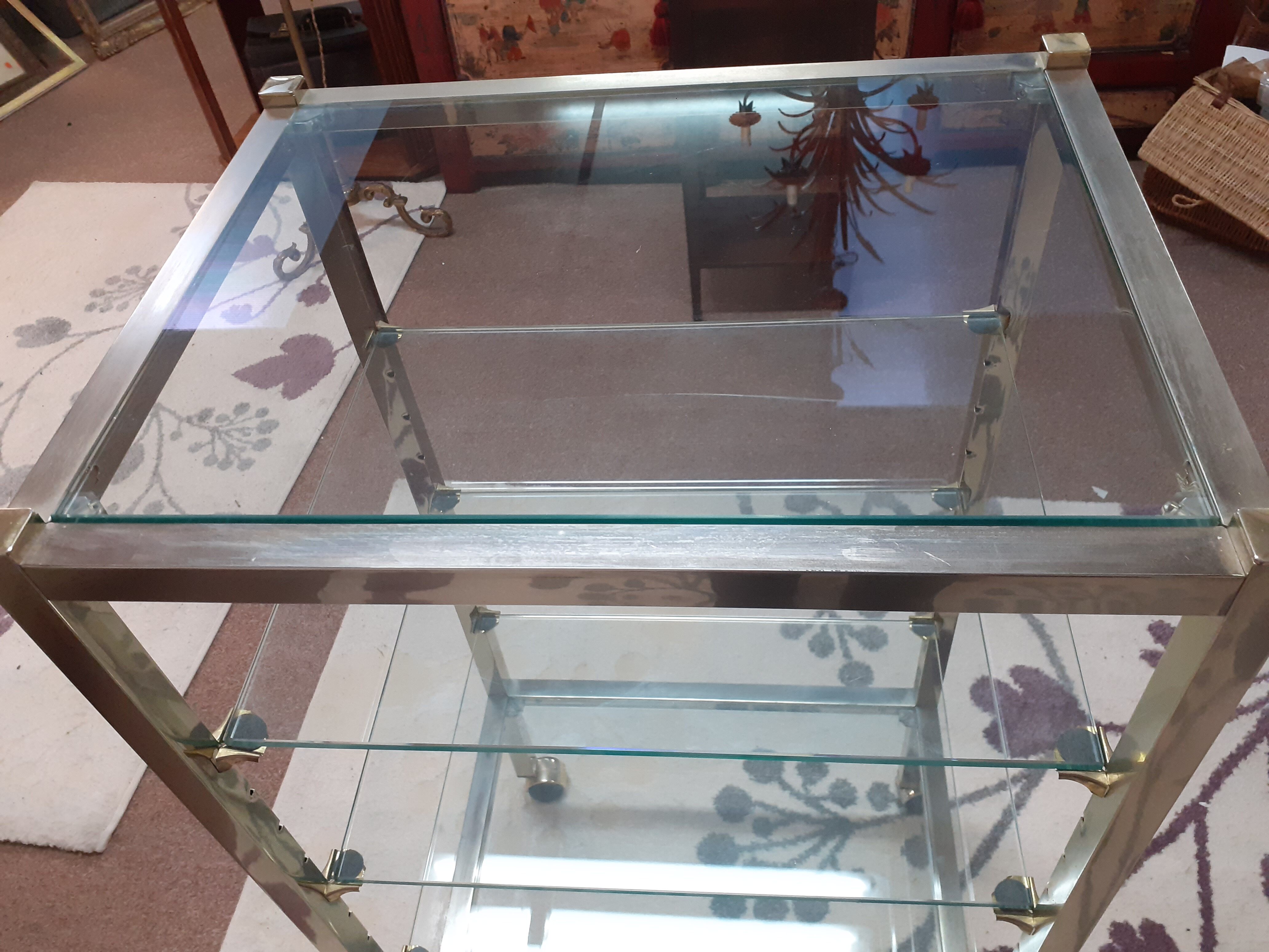 Glass and brass shelf on wheels