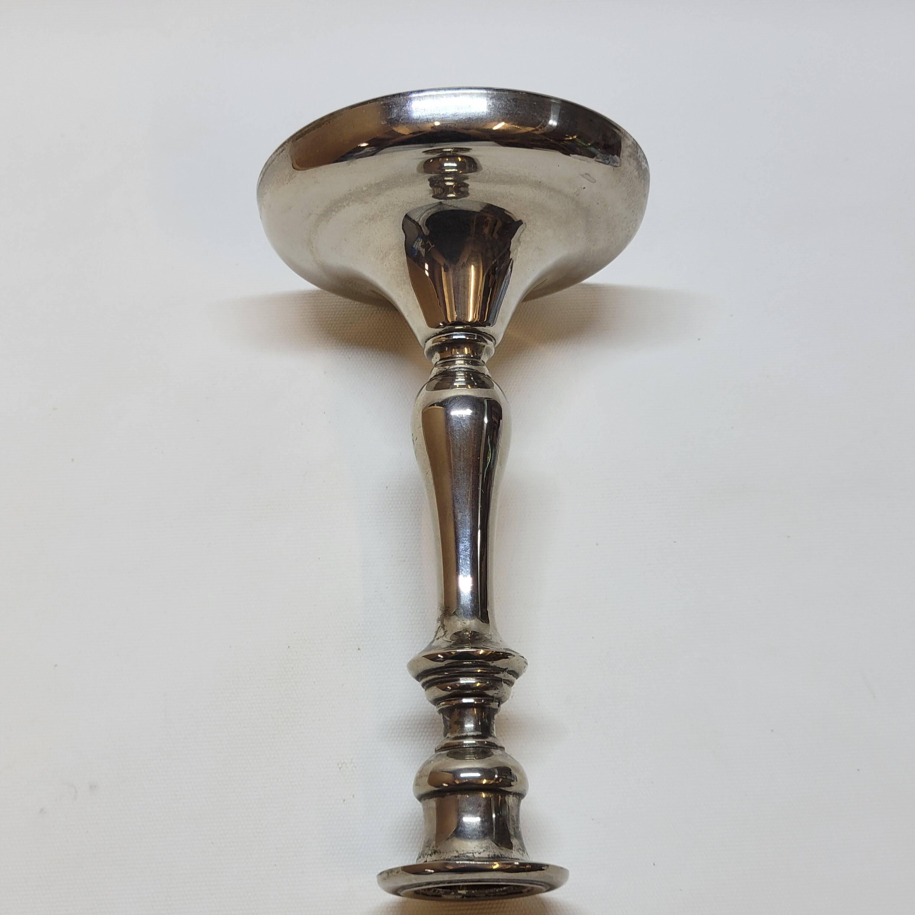 Old candle holder in silver metal