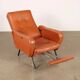 Vintage armchair from the 1970s in foam, faux leather, and metal.