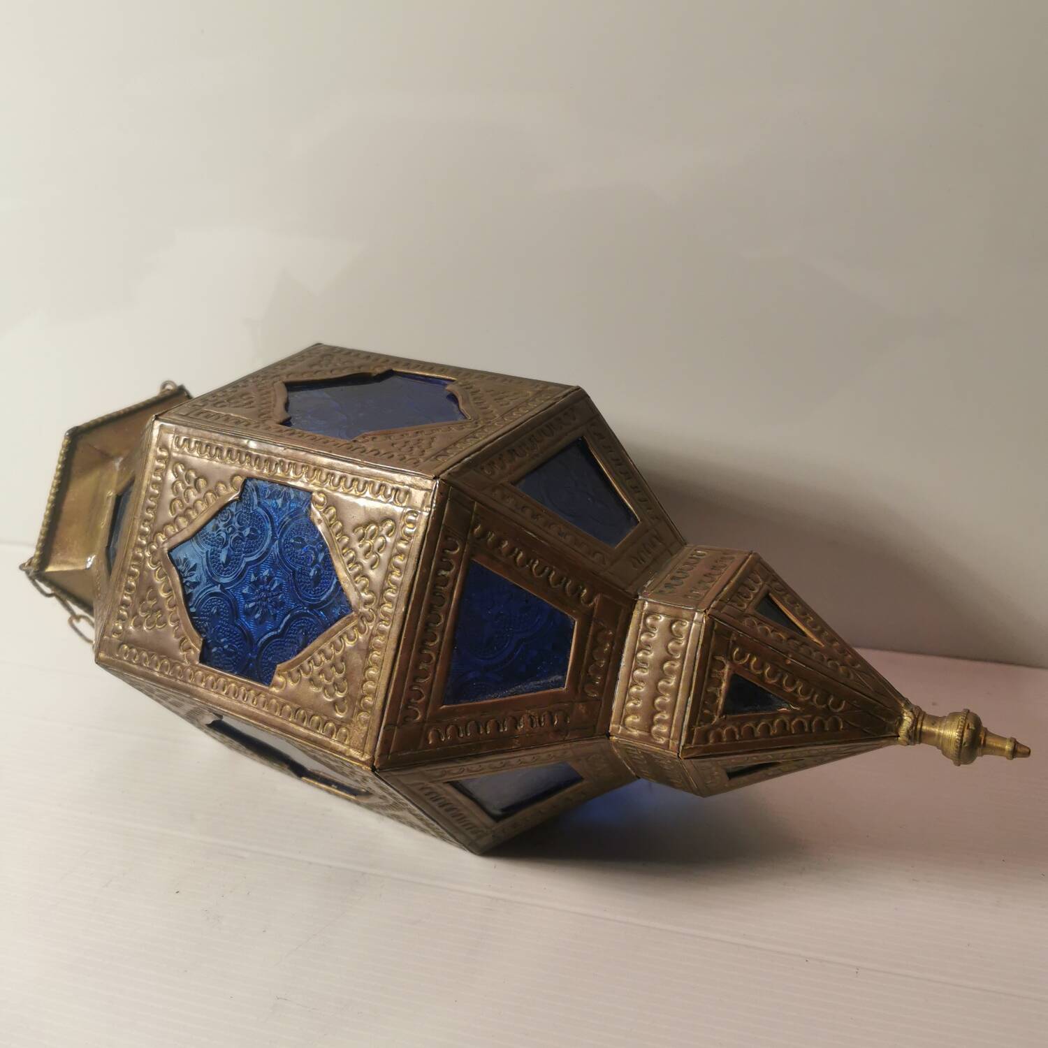 Oriental style hanging lantern in brass and dark blue glass
