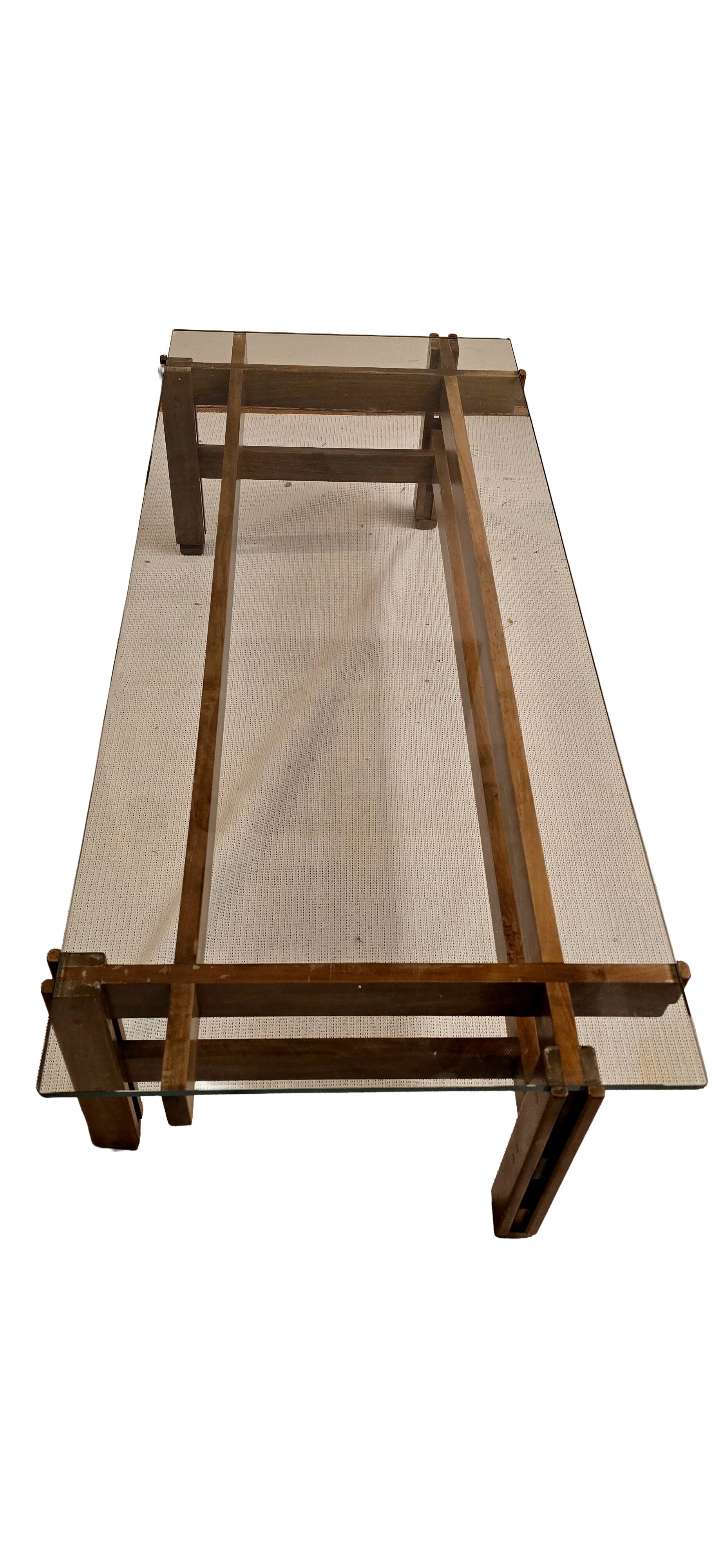 Glass coffee table with a wooden frame.