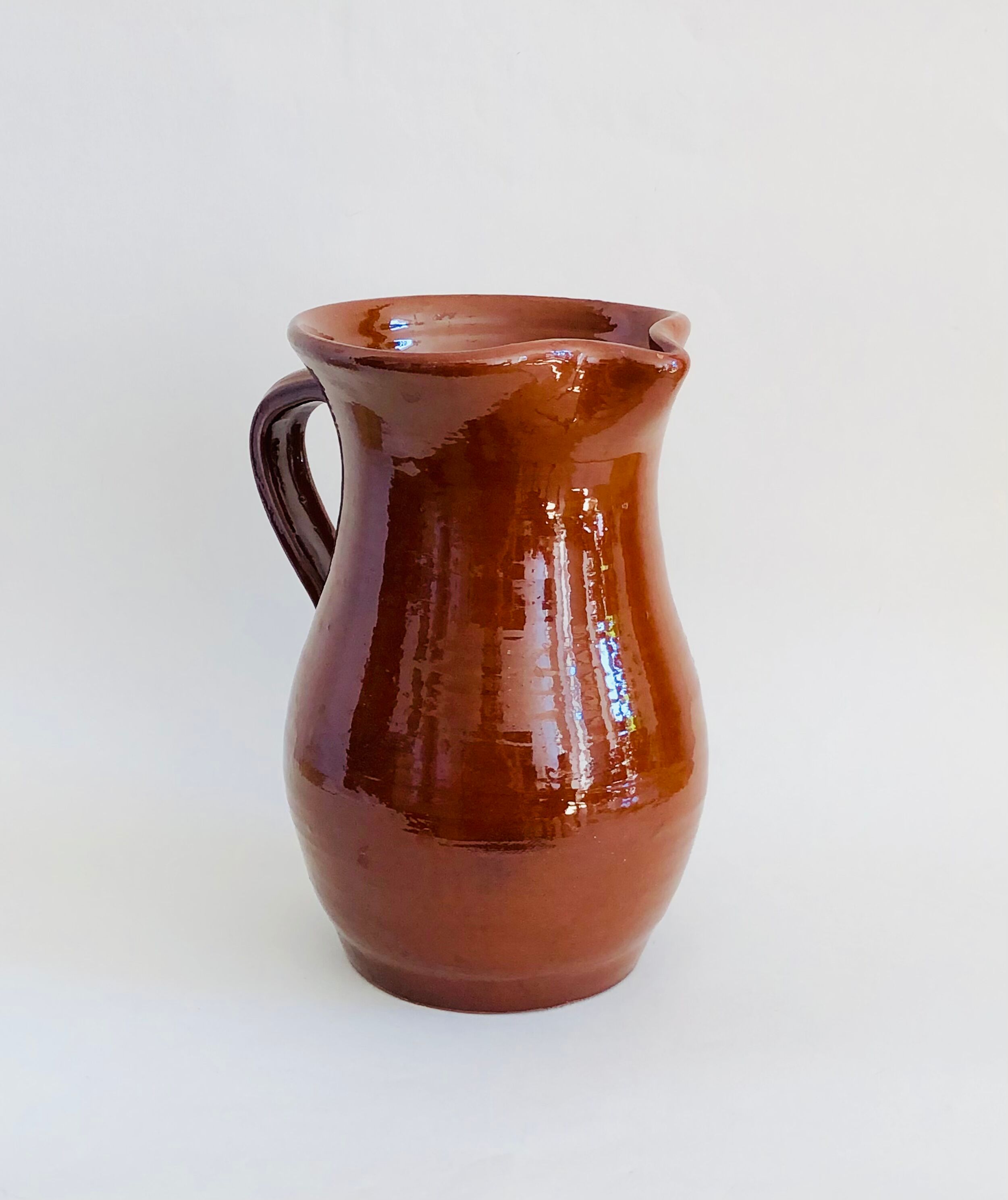 Vintage pitcher in glazed earth