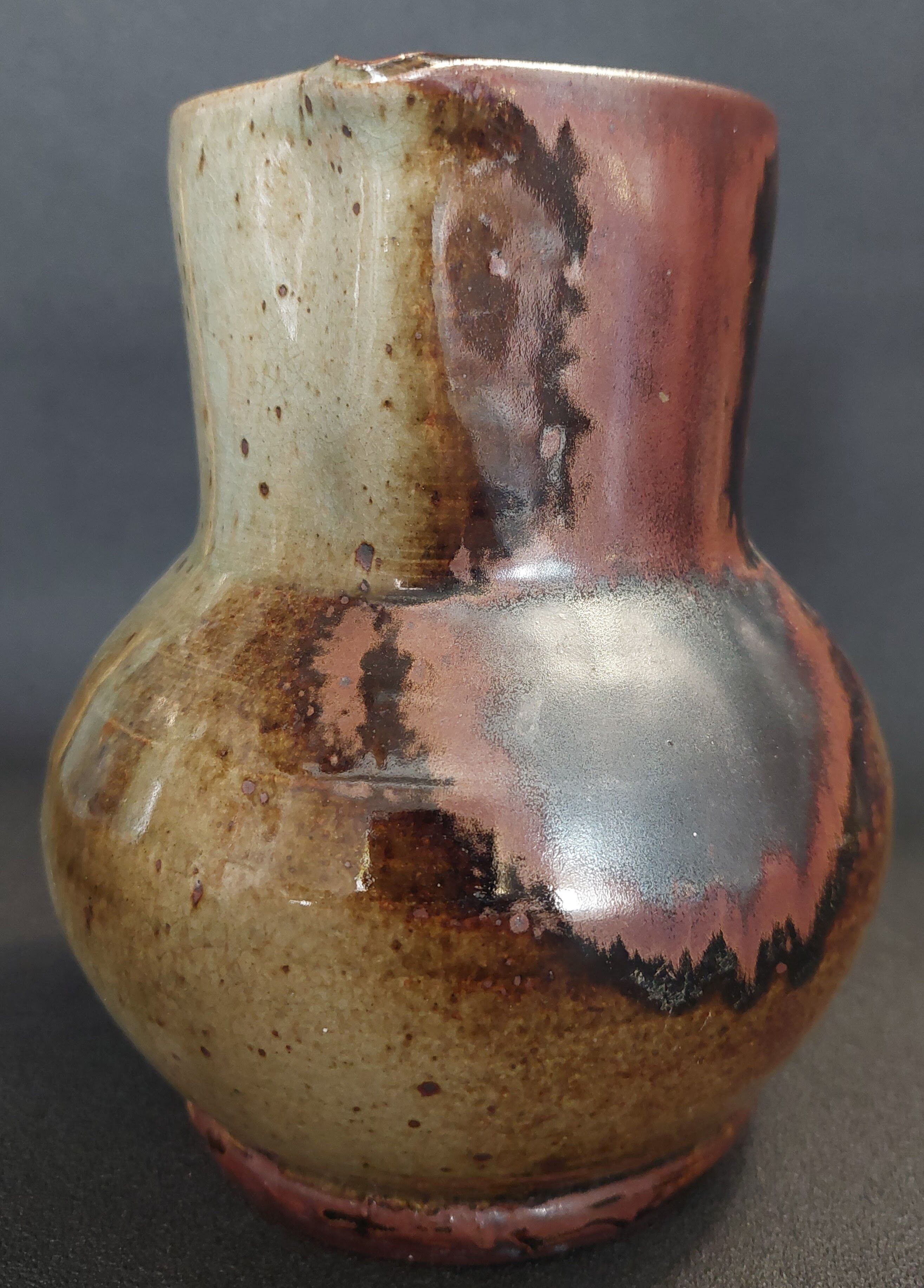 Glazed terracotta pitcher from the 20th century.