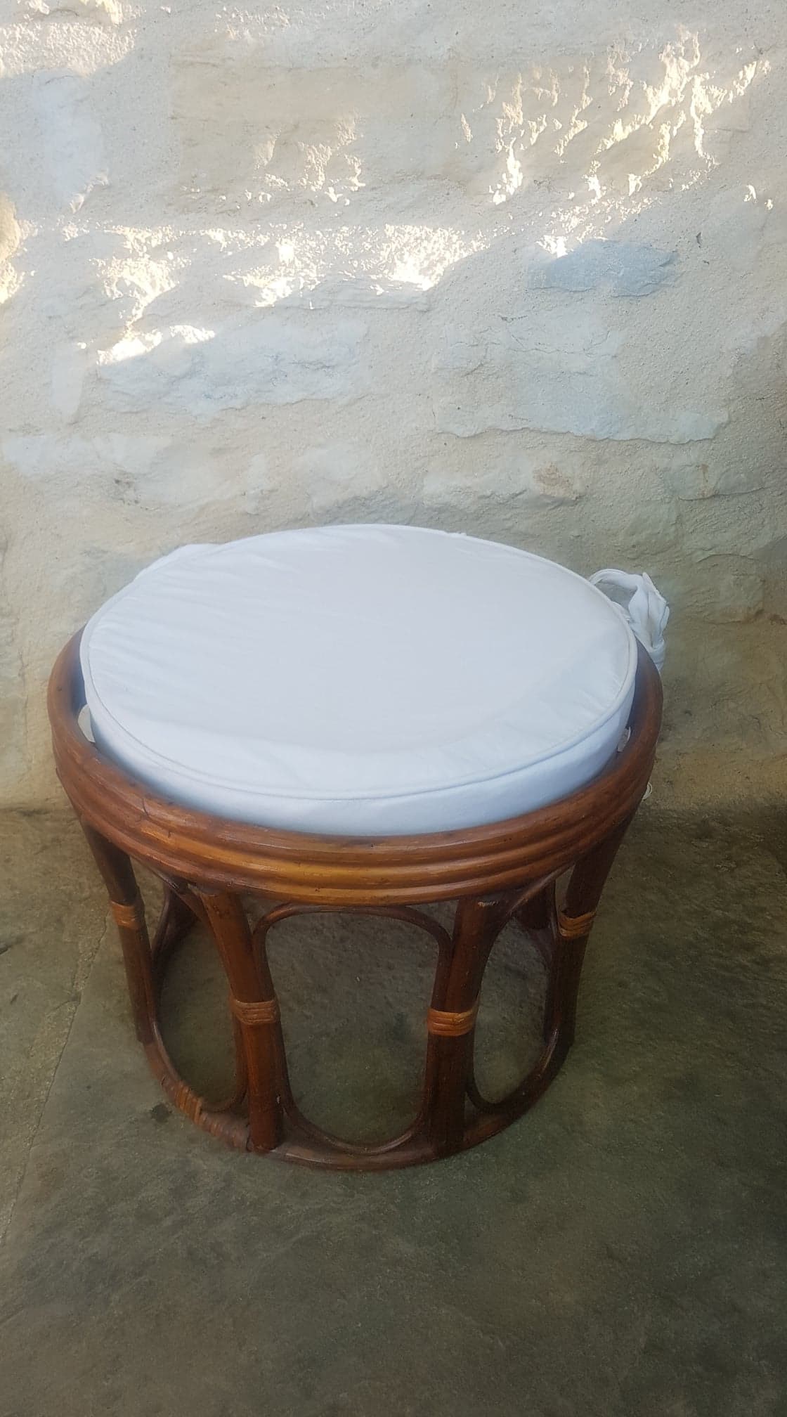 Rattan pouf with cushion