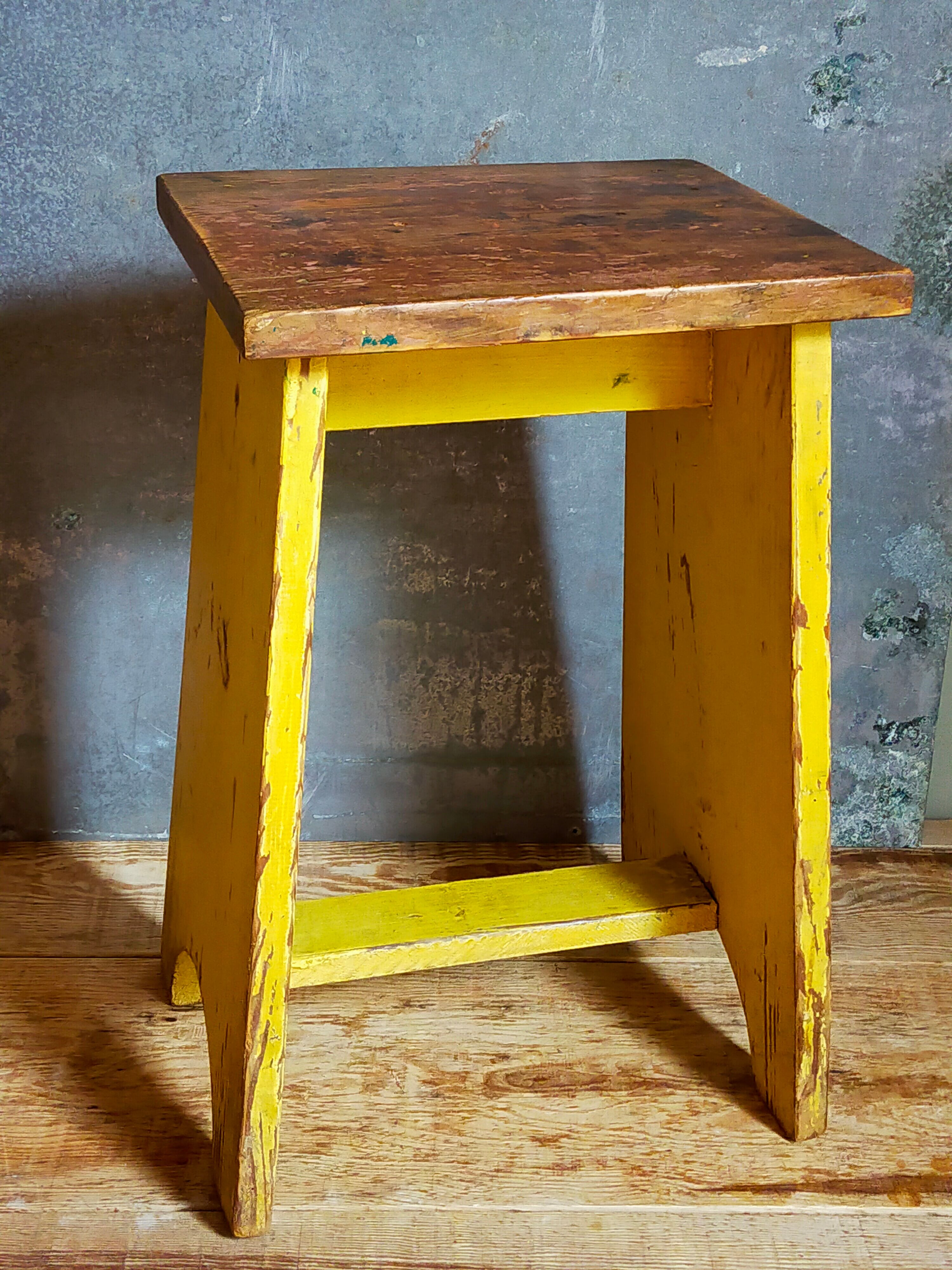 Art-populaire workshop stool in patinated wood